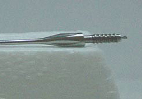Close up of finely machined surgical needle.